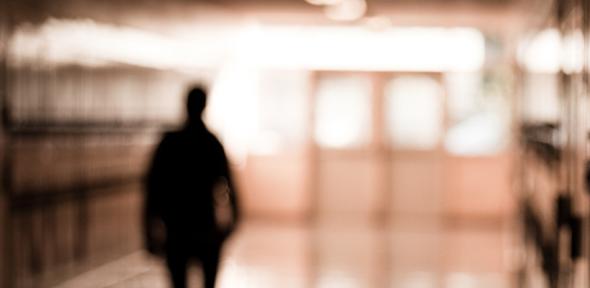 Boy in school corridor