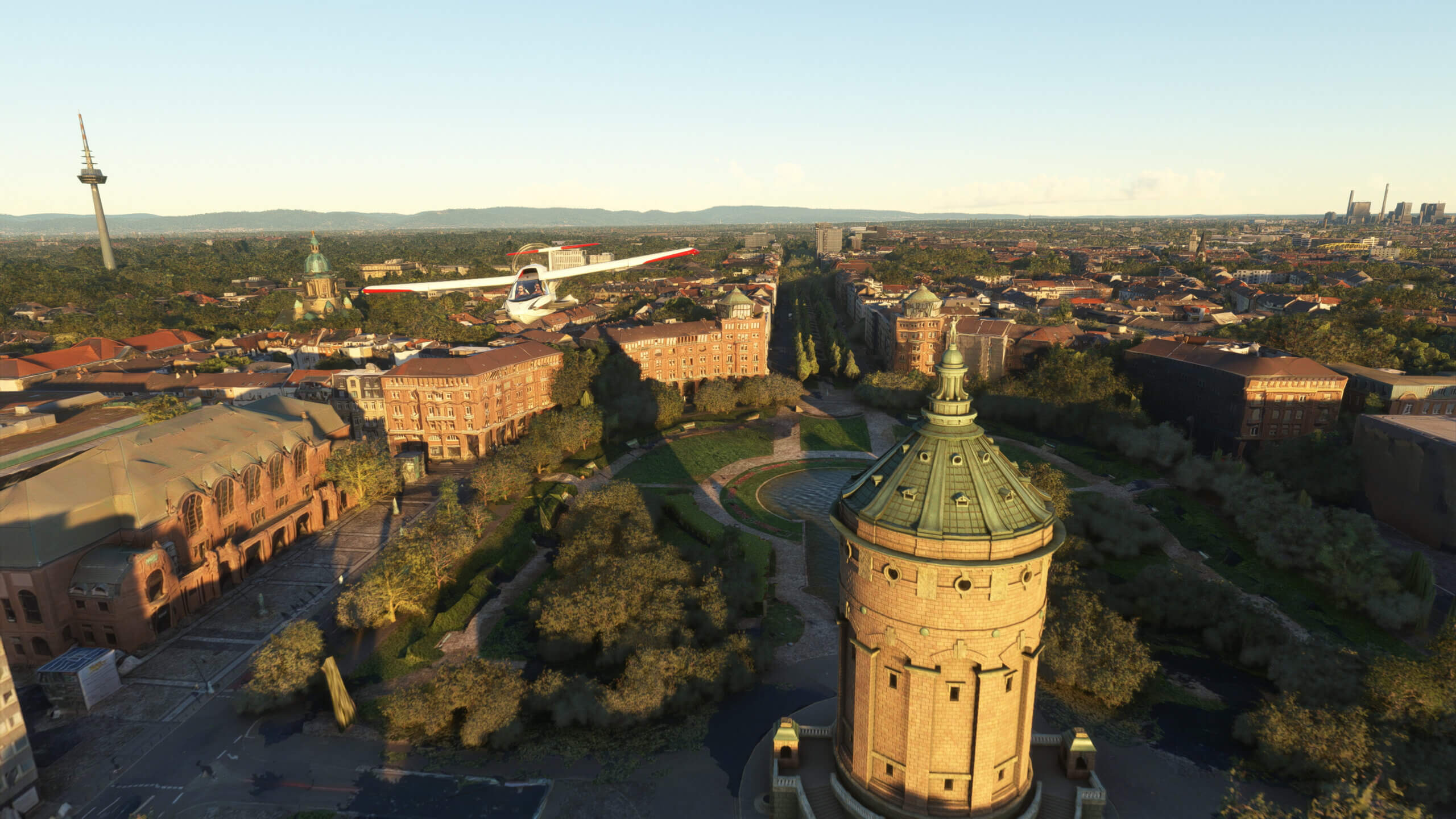 An ICON A5 flies over a German town.