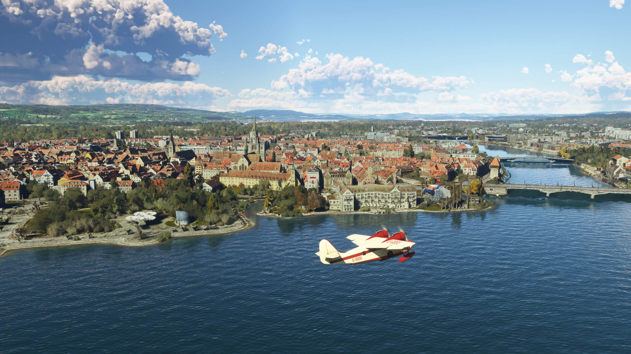 A Grumman Goose flies over a German town.