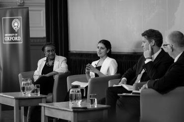 Image depicts panellists deep in discussion