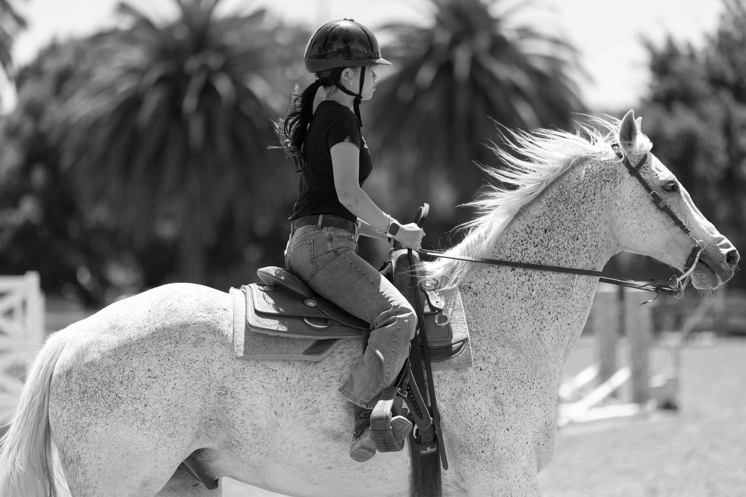 Image Angeline riding her horse.