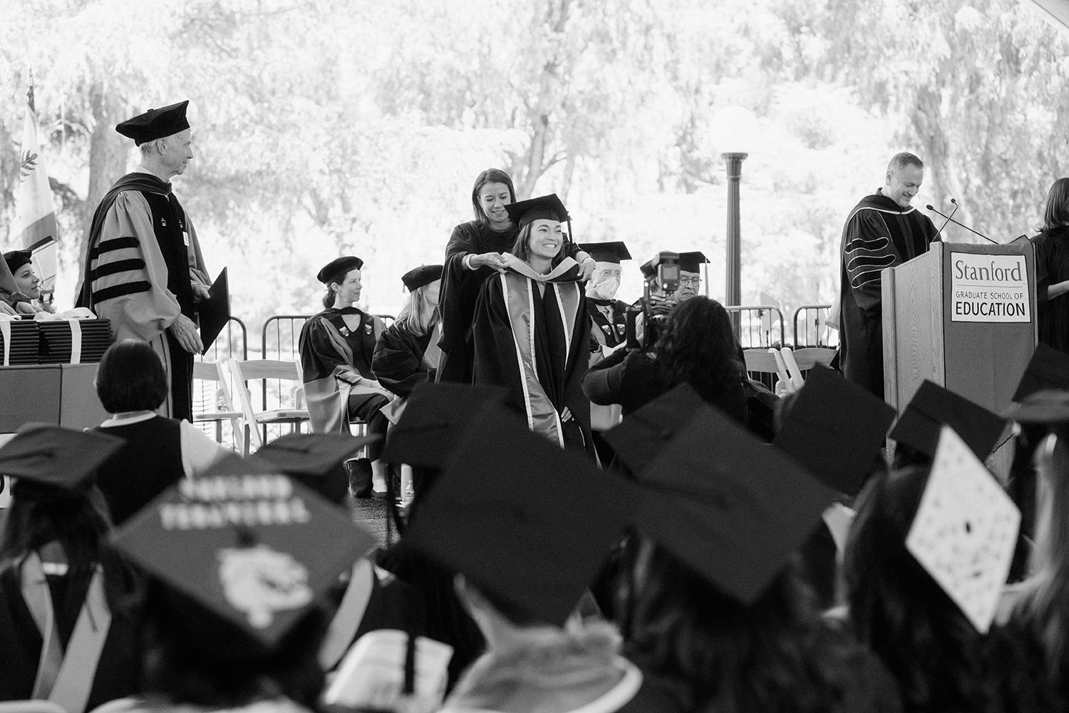 Image of a graduating student receiving honors during the ceremony.