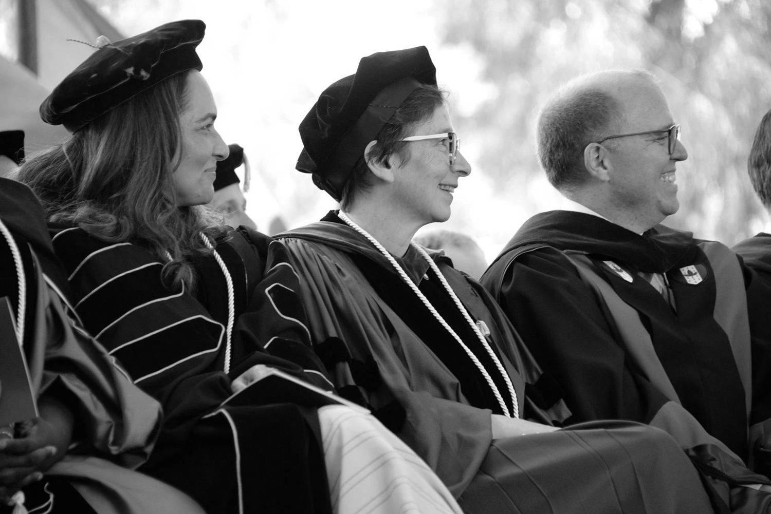 Image of Law School faculty listening to presenters during the Law School Commencement ceremony.