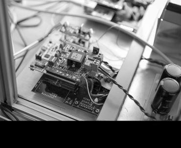 Close up of the components of a battery on a lab bench.