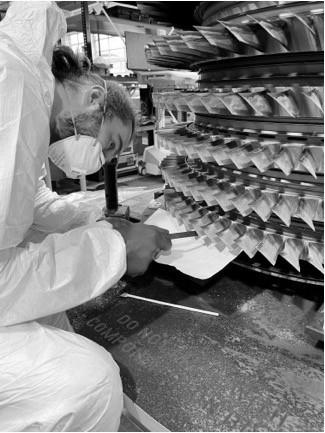 PhD student Drew Mullaney working on Rolls-Royce test engine. Credit: Dr Merren Jones, The University of Manchester