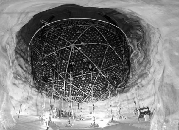 A giant suspended dome structure, within an underground chamber.