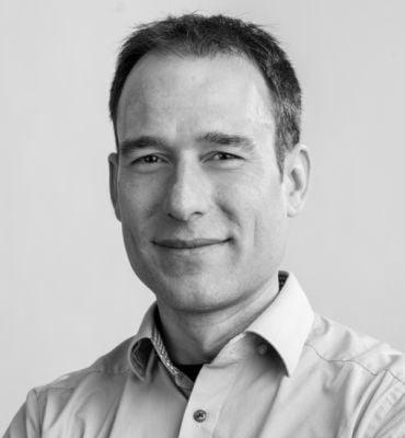 Portrait of Professor Moritz Riede, a white man with short dark hair.