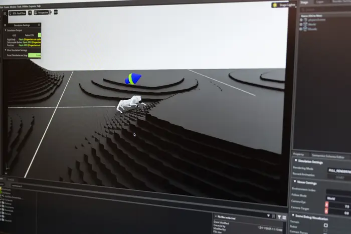 closeup of computer screen showing simulation of robotic dog climbing steps