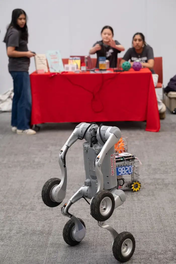 A robot stands on two wheels at the event.
