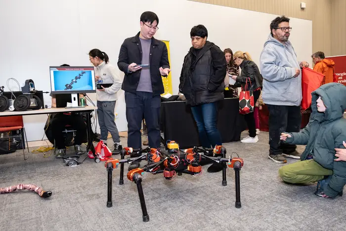 Community members enjoy a demonstration of a drone at the RIC.