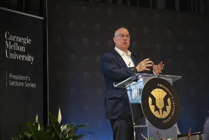 Ted Decker speaks at a podium.