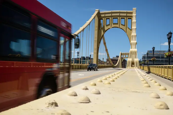 A bus crosses a bridge in Downtown Pittsburgh.