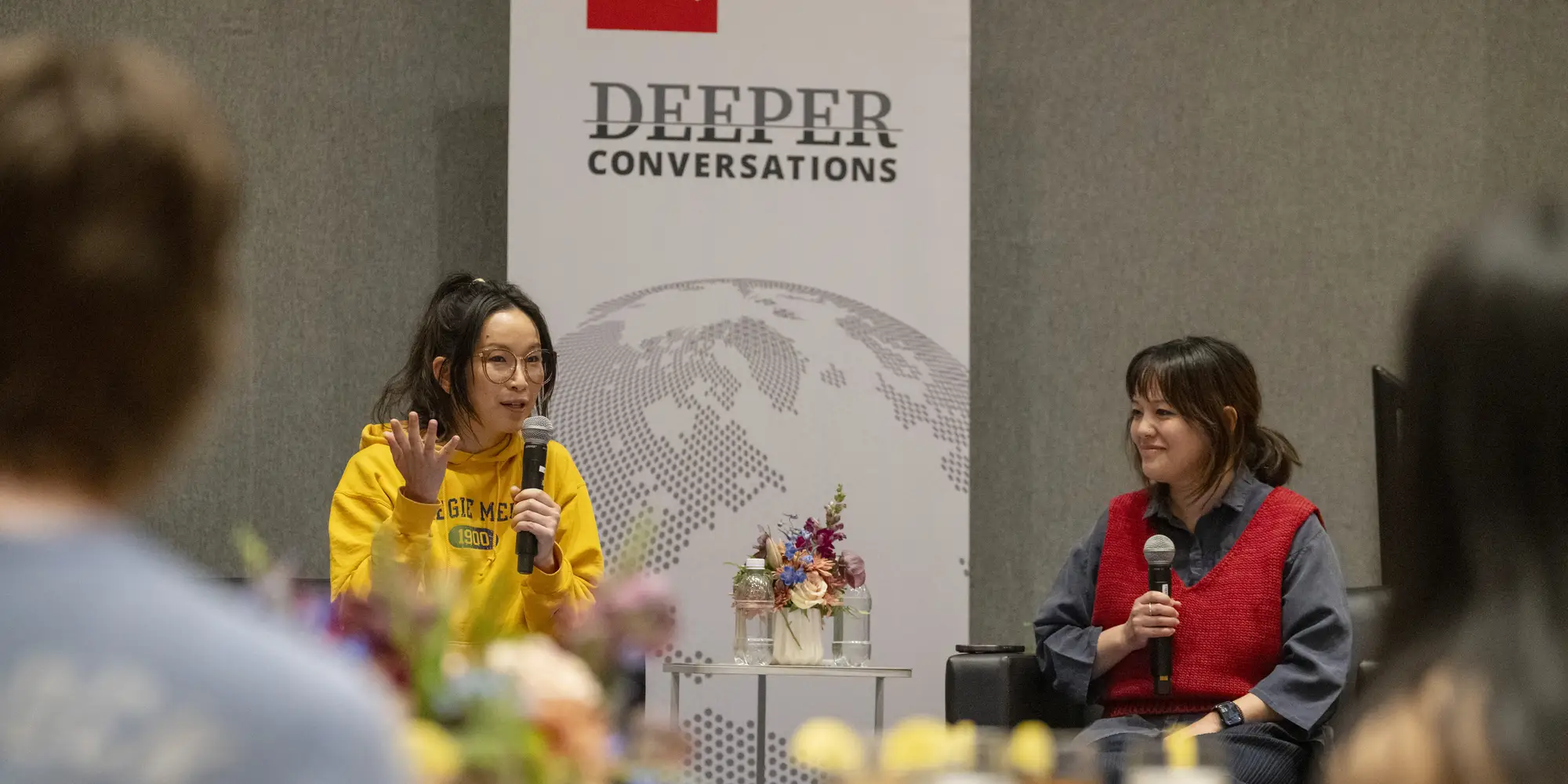 CMU alumnae Tria Chang and Justine Lee speak to a group of students gathered for dinner and a conversation.