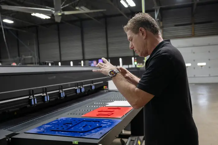Burton Morris takes a picture of several pieces in various states of completion.