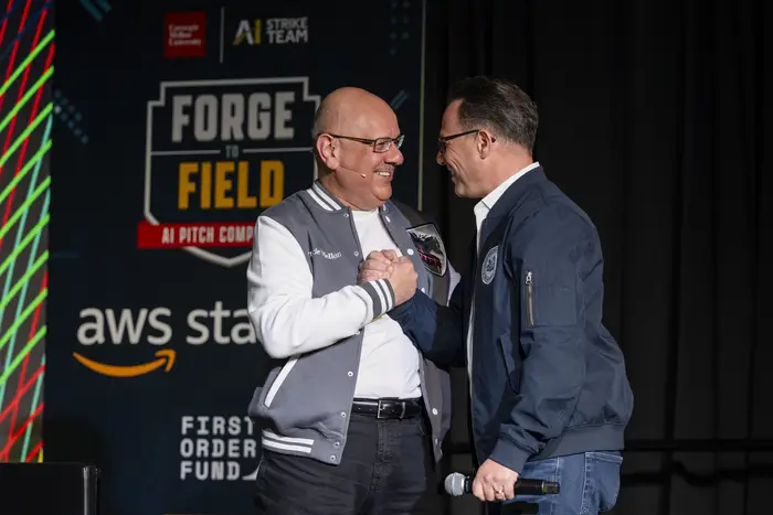 Farnam Jahanian greets Gov. Josh Shapiro at the Forge to Field AI Pitch Competition.