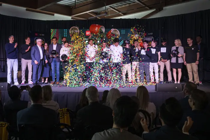 Confetti falls on the contestants.