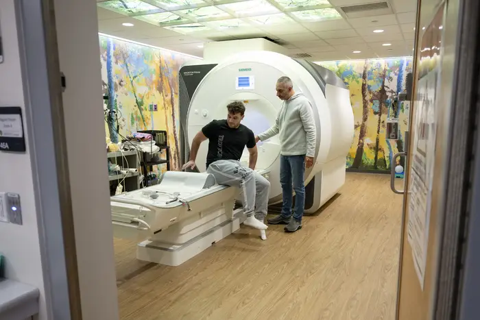 Player getting into MRI