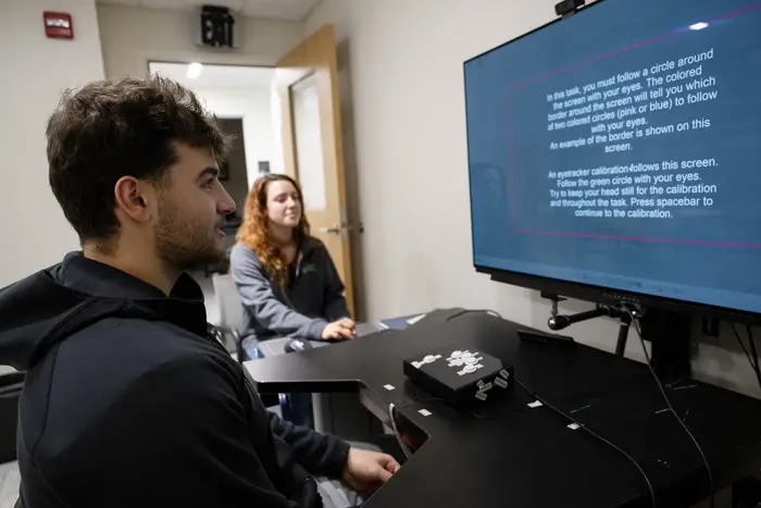 Logan Armstrong looking at computer screen