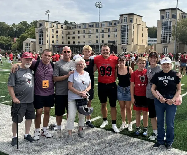 Provencher family standing on Lackner Field